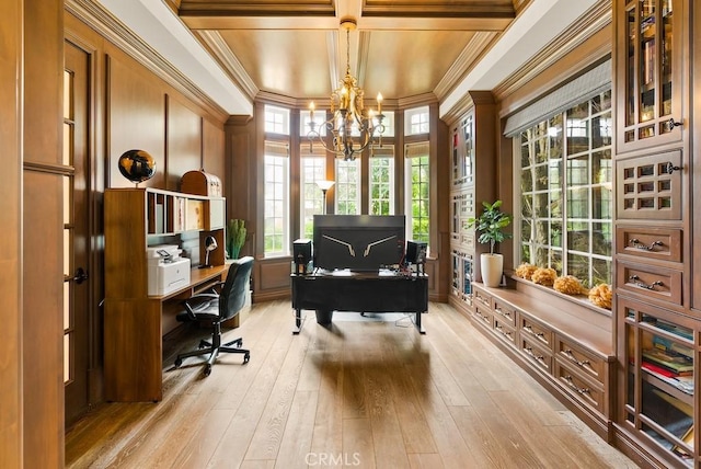 office area featuring coffered ceiling, crown molding, light wood-style flooring, and an inviting chandelier