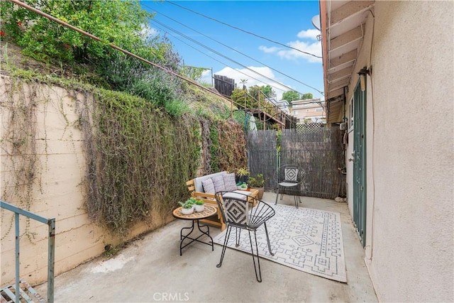 view of patio / terrace featuring fence