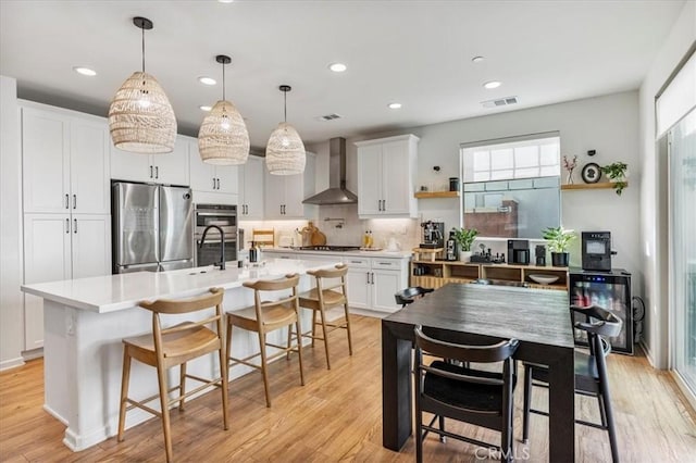 16452 Globetrotter Ave, Chino, CA 91708 - kitchen featuring visible vents, open shelves, wall chimney exhaust hood, tasteful backsplash, and appliances with stainless steel finishes