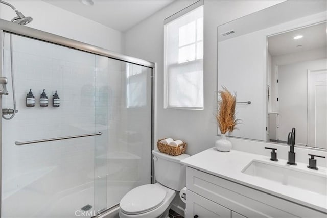 16452 Globetrotter Ave, Chino, CA 91708 - bathroom featuring toilet, visible vents, a shower stall, and vanity