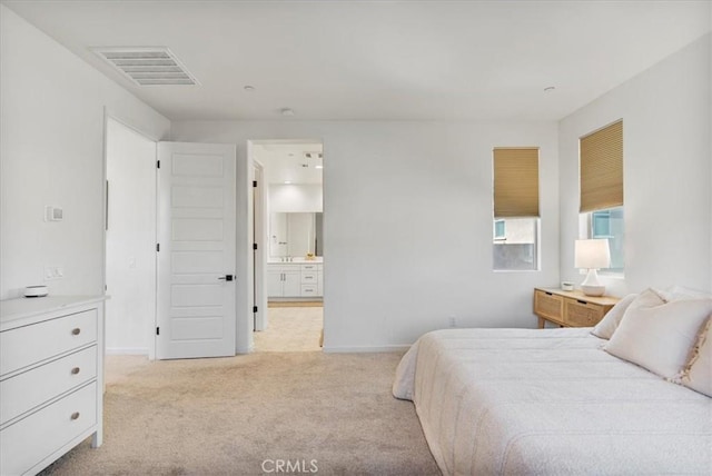 16452 Globetrotter Ave, Chino, CA 91708 - carpeted bedroom with baseboards, visible vents, and ensuite bathroom