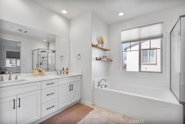 16452 Globetrotter Ave, Chino, CA 91708 - bathroom featuring visible vents, plenty of natural light, a sink, and a stall shower
