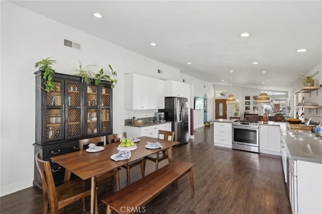 interior space featuring visible vents, recessed lighting, baseboards, and dark wood-style floors