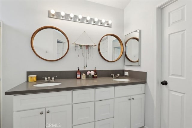 bathroom featuring double vanity and a sink