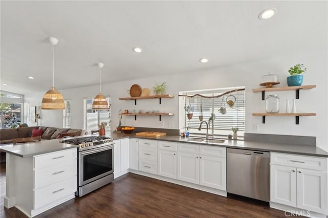 39896 Osprey Rd, Murrieta, CA 92562 - kitchen with appliances with stainless steel finishes, a sink, open shelves, a peninsula, and white cabinetry