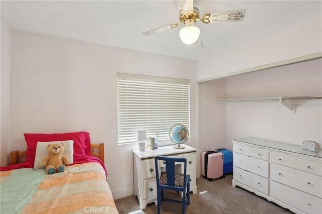 bedroom with ceiling fan, carpet, and a closet