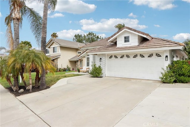 traditional-style house featuring an attached garage and driveway