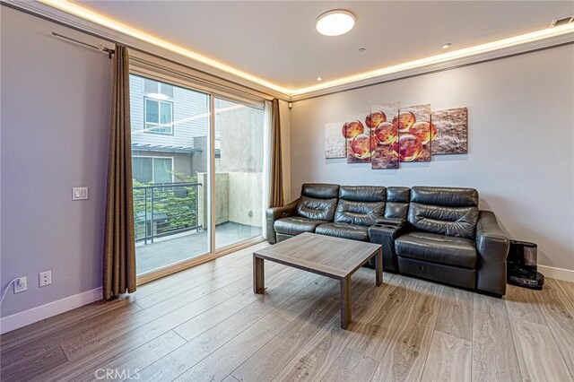 living room featuring baseboards and light wood-style floors