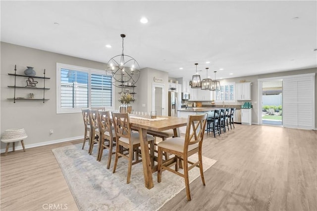 29102 Carrotwood, Lake Elsinore, CA 92530 - dining area featuring a chandelier, light wood-style flooring, healthy amount of natural light, and recessed lighting