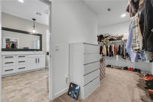 29102 Carrotwood, Lake Elsinore, CA 92530 - walk in closet with light stone finish flooring and a sink