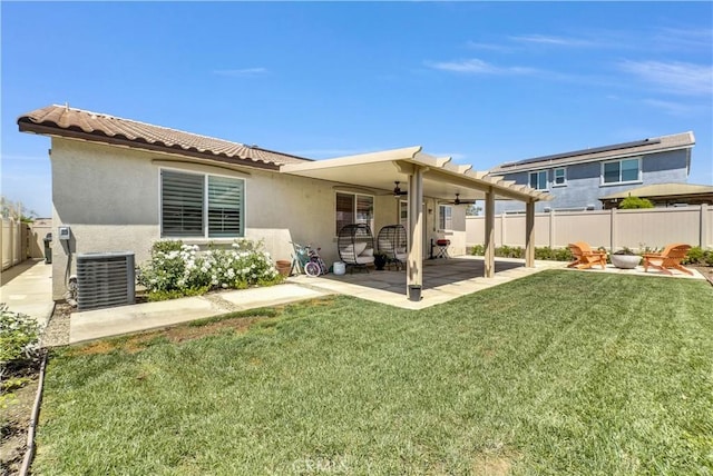 29102 Carrotwood, Lake Elsinore, CA 92530 - back of property with a ceiling fan, a fenced backyard, stucco siding, a patio area, and a fire pit