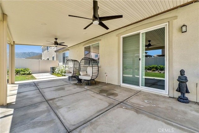 29102 Carrotwood, Lake Elsinore, CA 92530 - view of patio with a ceiling fan and a mountain view