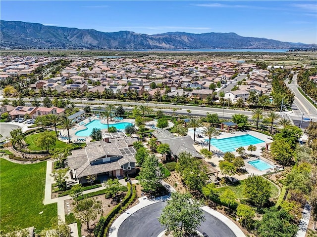 29102 Carrotwood, Lake Elsinore, CA 92530 - aerial perspective of suburban area with a pool area and mountains