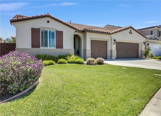 29102 Carrotwood, Lake Elsinore, CA 92530 - mediterranean / spanish-style home featuring a garage, stucco siding, driveway, and a tile roof