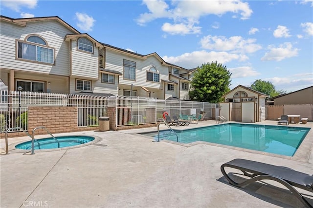 11150 Glenoaks Blvd Unit 98, Pacoima, CA 91331 - pool featuring fence, a hot tub, a residential view, and a patio