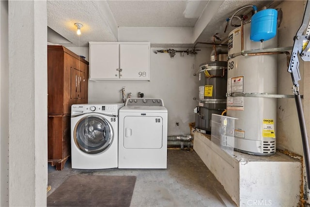 11150 Glenoaks Blvd Unit 98, Pacoima, CA 91331 - laundry room with cabinet space, strapped water heater, and washing machine and dryer