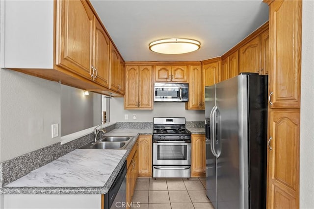 11150 Glenoaks Blvd Unit 98, Pacoima, CA 91331 - kitchen featuring brown cabinets, appliances with stainless steel finishes, light tile patterned floors, and a sink