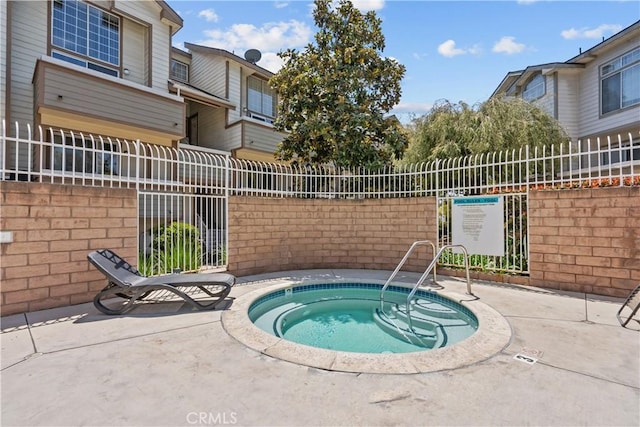 11150 Glenoaks Blvd Unit 98, Pacoima, CA 91331 - view of swimming pool featuring fence and a hot tub