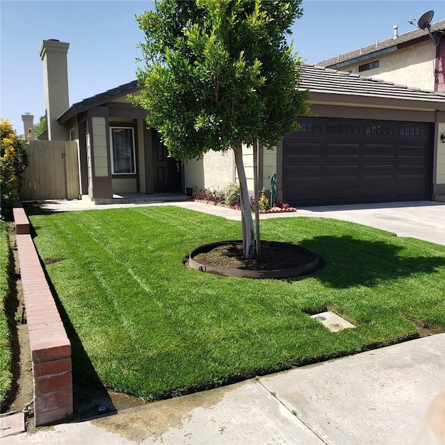 1912 W Quartermaster St, Colton, CA 92324 - view of front of house with an attached garage, driveway, stucco siding, and a tile roof