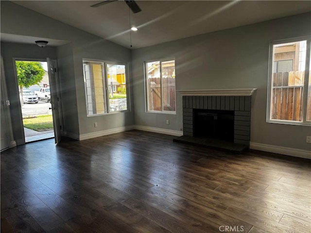 1912 W Quartermaster St, Colton, CA 92324 - unfurnished living room featuring ceiling fan, dark wood-style flooring, lofted ceiling, and a brick fireplace