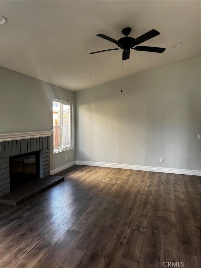 1912 W Quartermaster St, Colton, CA 92324 - unfurnished living room featuring dark wood-style floors, ceiling fan, a brick fireplace, and recessed lighting