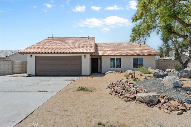 67305 Verona Rd, Cathedral City, CA 92234 - ranch-style home featuring an attached garage, stucco siding, driveway, and a tile roof