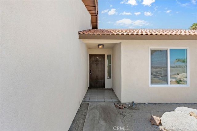 67305 Verona Rd, Cathedral City, CA 92234 - property entrance featuring stucco siding and a tile roof