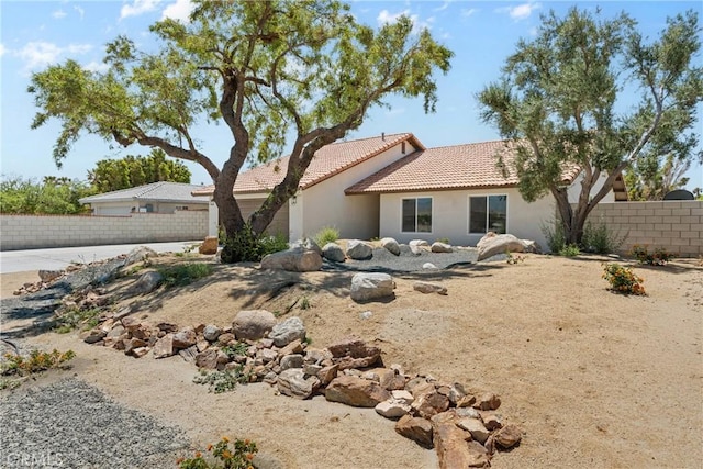 67305 Verona Rd, Cathedral City, CA 92234 - rear view of house with a tiled roof and stucco siding