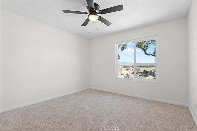 67305 Verona Rd, Cathedral City, CA 92234 - carpeted empty room with baseboards and a ceiling fan