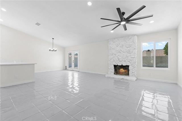 67305 Verona Rd, Cathedral City, CA 92234 - unfurnished living room featuring tile patterned flooring, a stone fireplace, recessed lighting, a chandelier, and baseboards