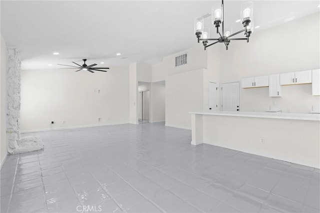 67305 Verona Rd, Cathedral City, CA 92234 - unfurnished living room with a chandelier, recessed lighting, a ceiling fan, light tile patterned flooring, and baseboards