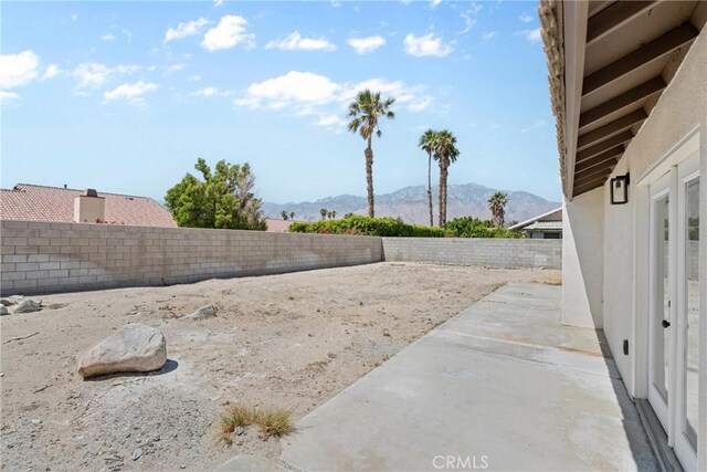 67305 Verona Rd, Cathedral City, CA 92234 - fenced backyard with a mountain view and a patio