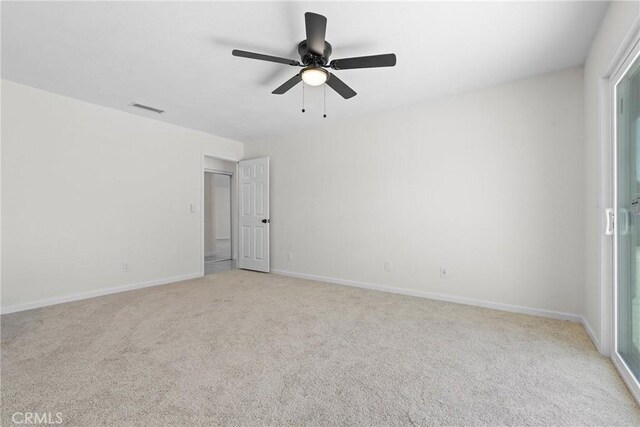 67305 Verona Rd, Cathedral City, CA 92234 - empty room featuring light colored carpet, ceiling fan, and baseboards
