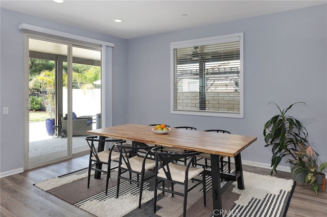 dining room featuring plenty of natural light, light wood-style flooring, recessed lighting, and baseboards