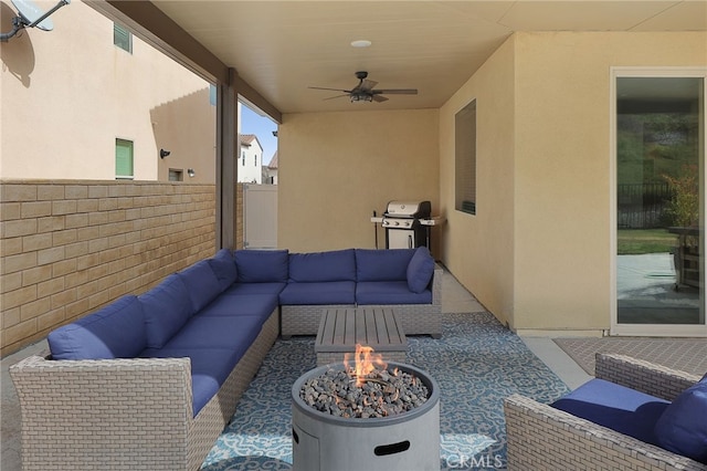 view of patio / terrace featuring an outdoor living space with a fire pit, a ceiling fan, grilling area, and fence