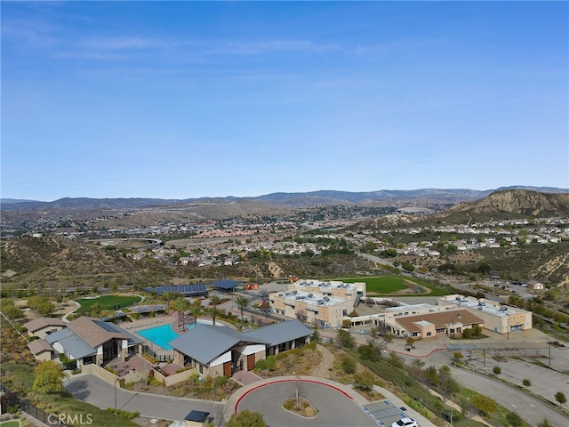 birds eye view of property featuring a mountain view