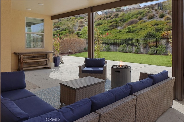 view of patio / terrace featuring an outdoor living space with a fire pit and a fenced backyard