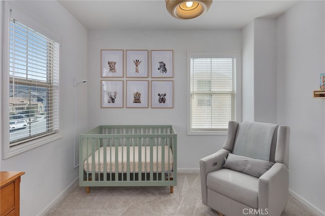 bedroom with multiple windows and carpet