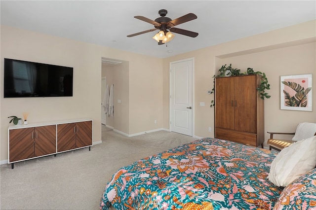 bedroom with baseboards, a ceiling fan, and light colored carpet