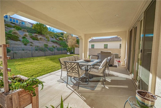 view of patio / terrace featuring fence and outdoor dining space