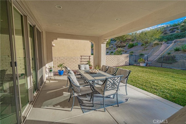 view of patio / terrace with outdoor dining area and a fenced backyard