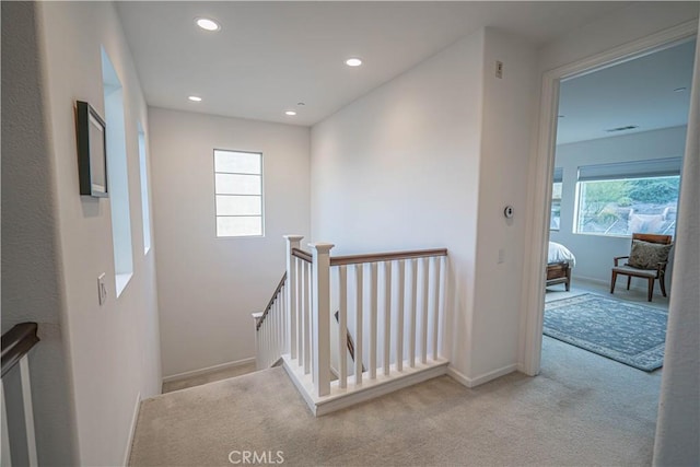 stairway featuring carpet, visible vents, recessed lighting, and baseboards
