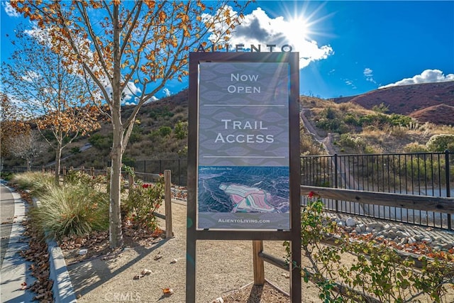 exterior space with a mountain view and fence
