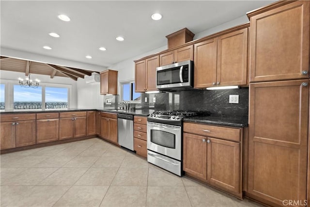 4101 Paseo De Las Tortugas, Torrance, CA 90505 - kitchen featuring appliances with stainless steel finishes, brown cabinets, tasteful backsplash, recessed lighting, and a chandelier