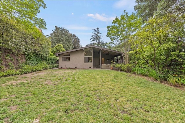 527 Bradford St, Pasadena, CA 91105 - back of property featuring a yard, stucco siding, and a sunroom