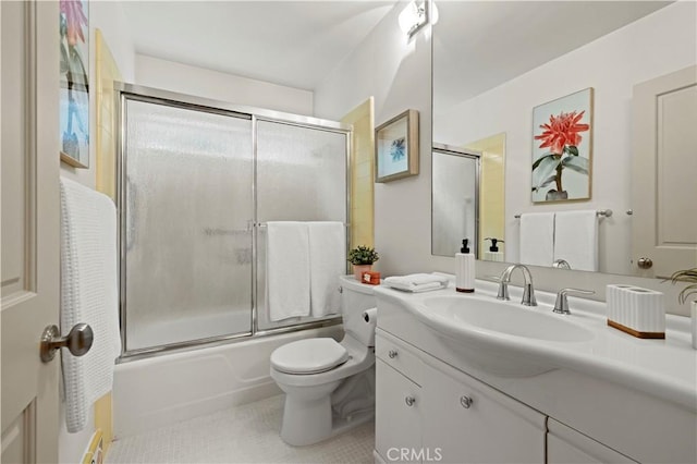 527 Bradford St, Pasadena, CA 91105 - bathroom with vanity, combined bath / shower with glass door, tile patterned floors, and toilet