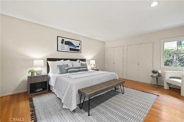 527 Bradford St, Pasadena, CA 91105 - bedroom with recessed lighting, light wood-style flooring, and two closets