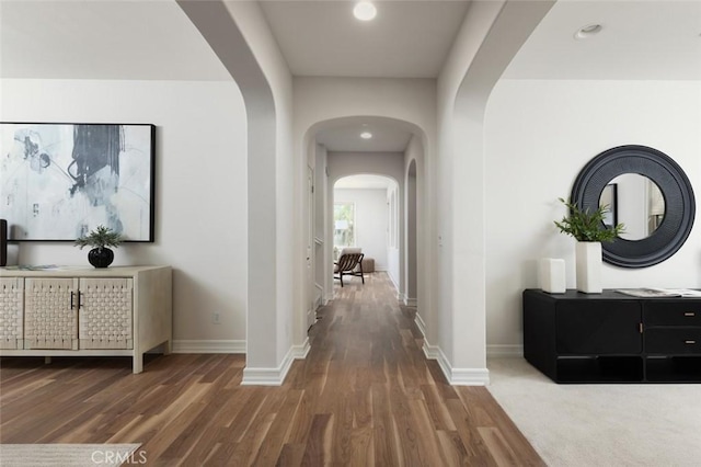 26 Via Fontibre, San Clemente, CA 92673 - hall with arched walkways, baseboards, recessed lighting, and wood finished floors