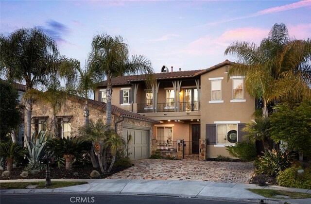 26 Via Fontibre, San Clemente, CA 92673 - townhome / multi-family property featuring a balcony, stucco siding, decorative driveway, stone siding, and a tiled roof