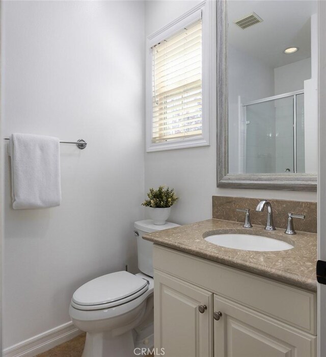 26 Via Fontibre, San Clemente, CA 92673 - bathroom featuring vanity, toilet, and an enclosed shower
